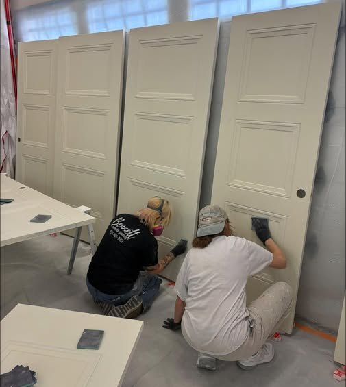 Bennett Interior Painting crew member painting interior doors