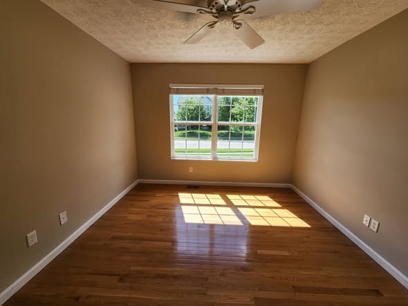 Freshly painted room over hardwood floors